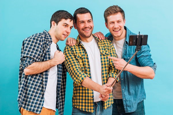 3 boys wearing flannel shirts